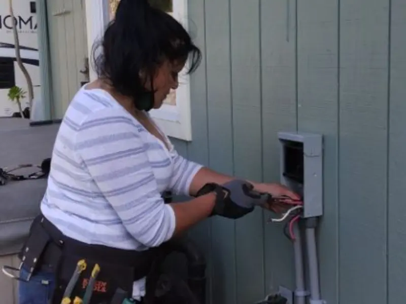 Licensed electrician wiring an exterior subpanel in Mullica